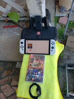 2024 Nintendo Switch OLED Big Screen not 16GB but 64GB with 128GB all works come with charger, case , sonic game with case $240! Free delivery. All wo