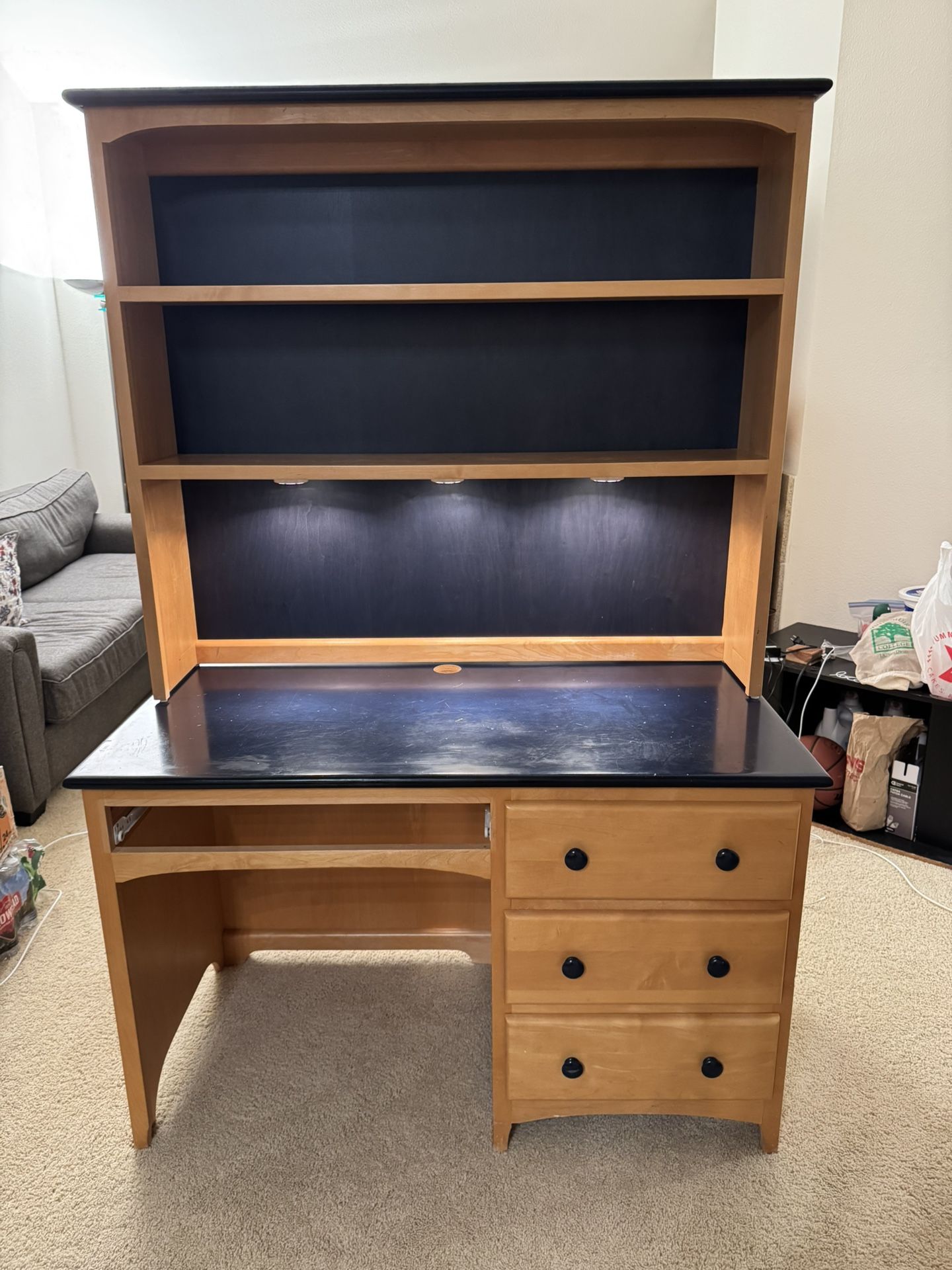 Selling a spacious wood desk with plenty of storage and lighting! ✨ Features: • Built-in overhead lights (perfect for studying or working) • 2 large