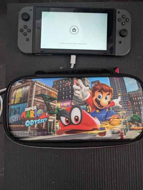 Nintendo Switch Console with Gray Joy-Con.