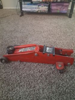Torn red jacks floor jack