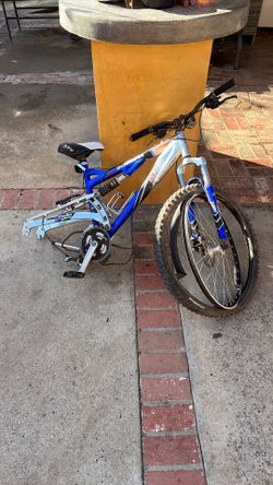The item pictured is a Schwinn S60 DSX mountain bike, a full-suspension model made with an aluminum frame