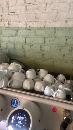 white porcelain coffee/espresso cups with saucers