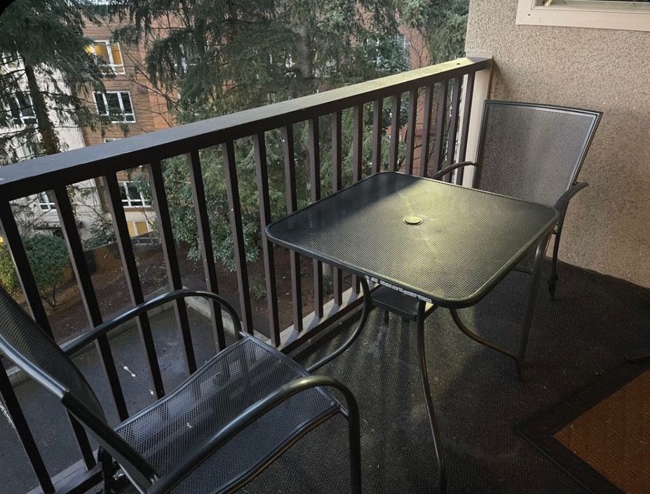 Two Balcony Chairs And A Table
