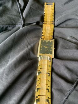 Men’s Croton gold watch