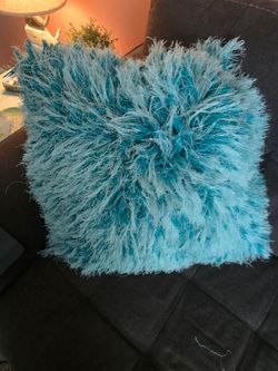 Shaggy teal throw pillow