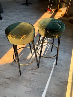 Pair of green velvet and gold marble pattern barstools