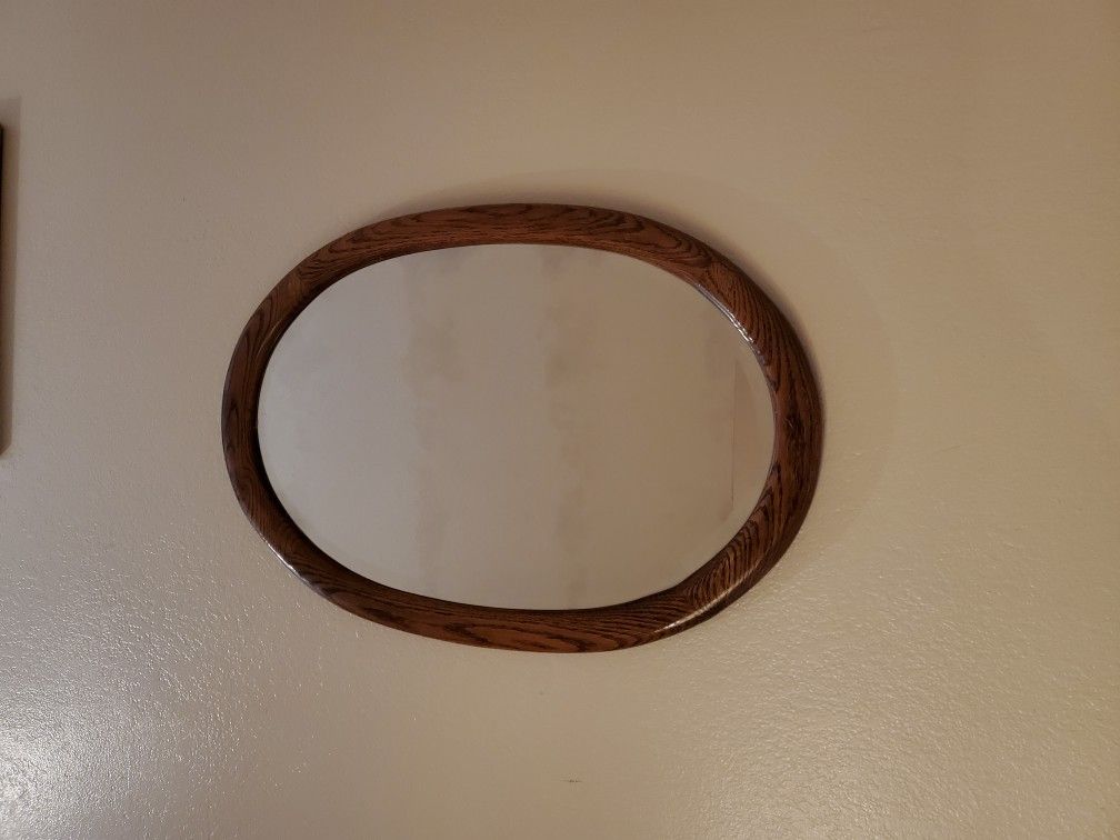 Beautiful oval oak framed mirror