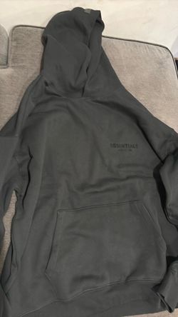 A black essential fear of god hoodie