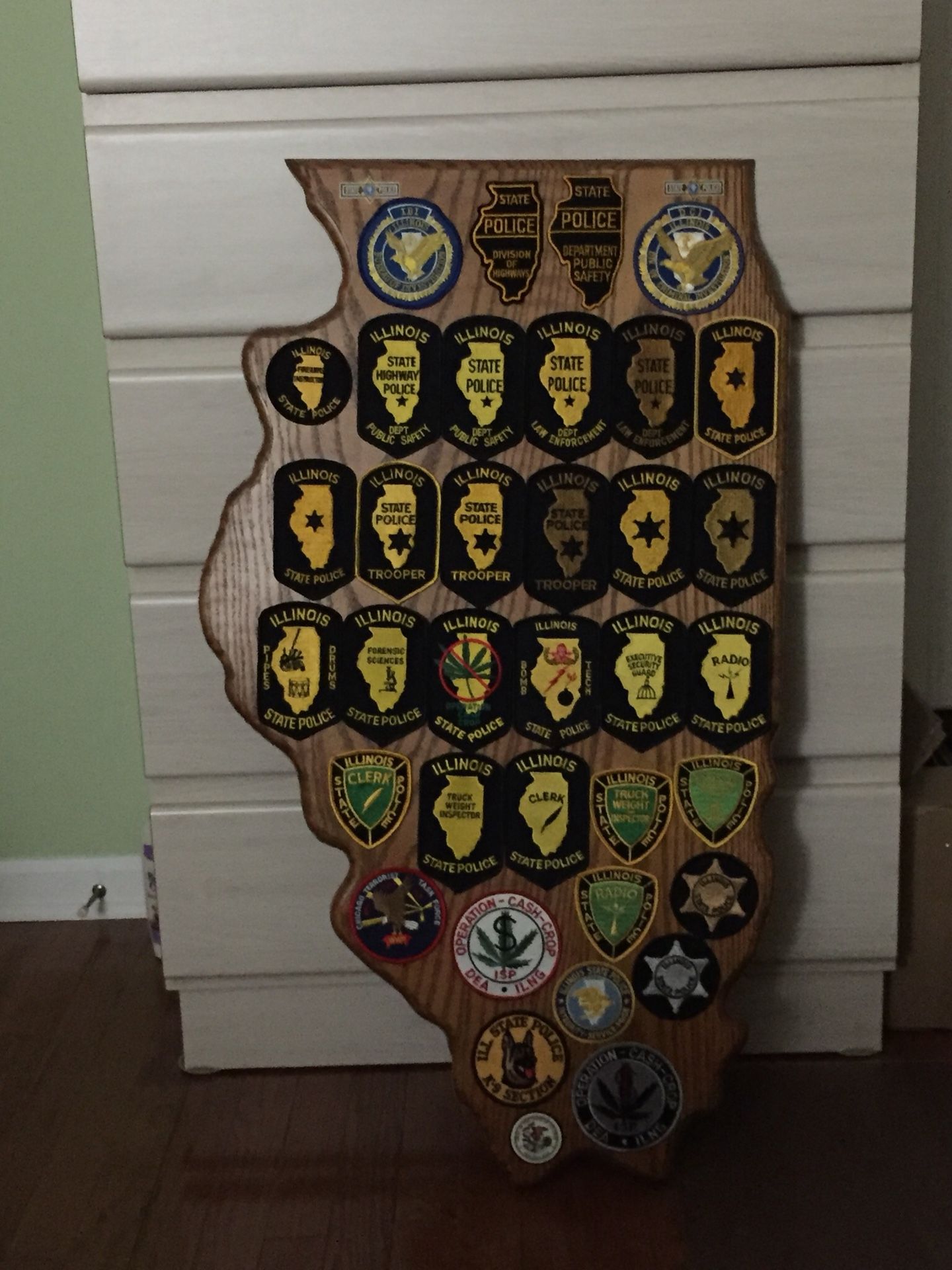 Illinois State Police patch display. Patches from early day to current. Mounted on 3/4 solid Oakwood these 34 patches are for display purposes only.