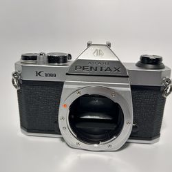 Pentax K1000 film camera body.