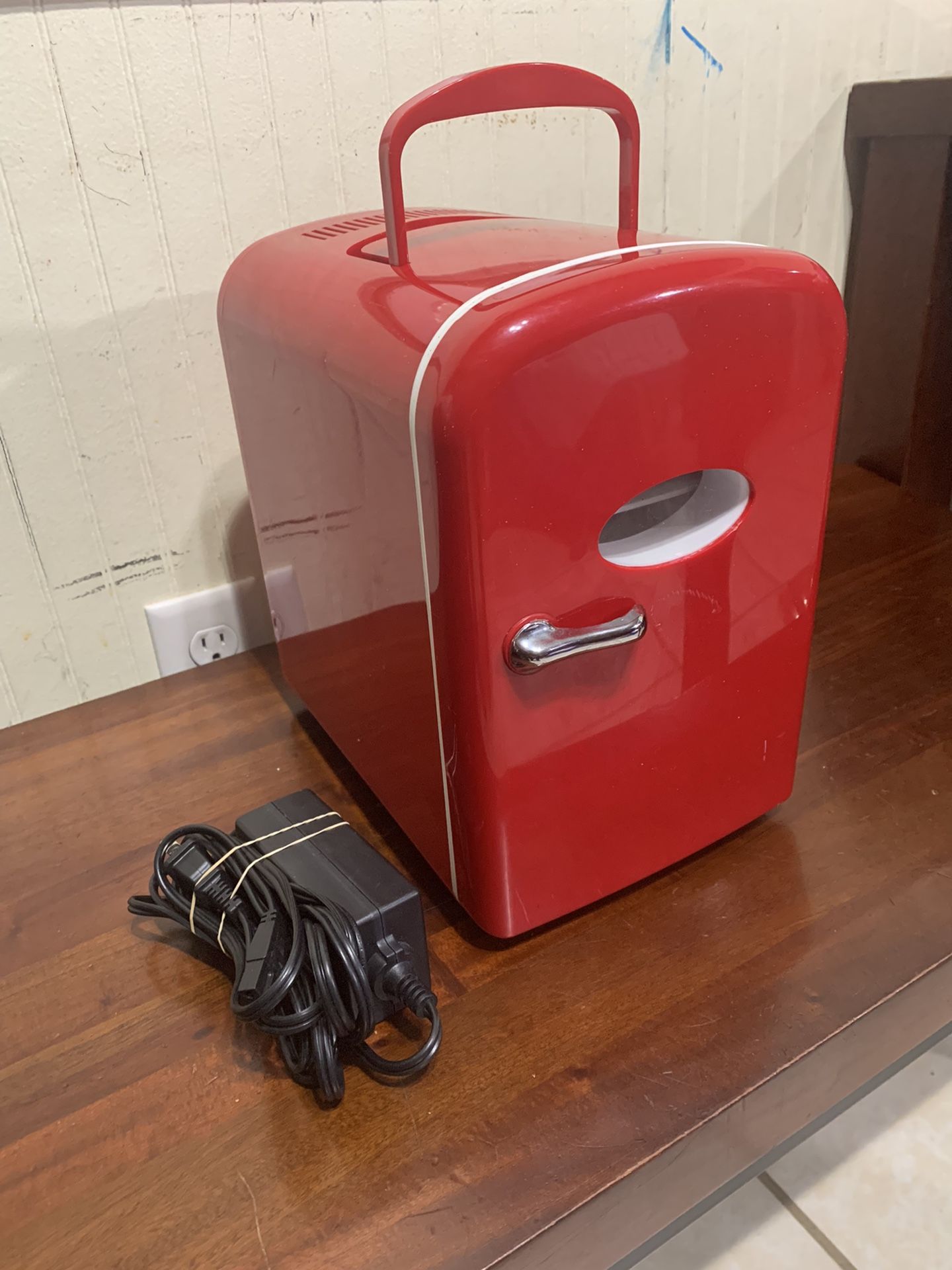 Mini red fridge (in great working Condition) 10 x 8, and 12 inches High. Details r In DESCRITTION