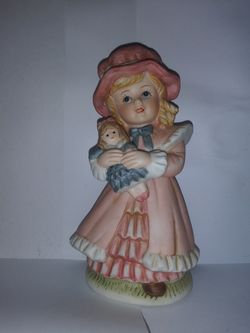 4-inch. PorcelainYoung girl holding her doll