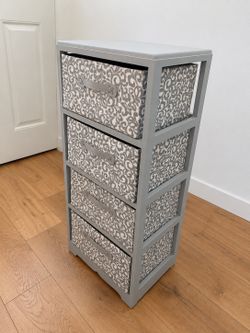 4-drawer storage organizer in gray wood frame with patterned fabric bins