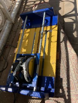 Yellow and blue saw table tool heavy