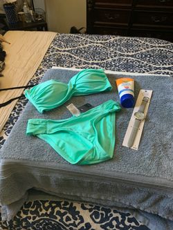 New Bikini swimsuit with the free watch!Top size medium and Bottom small !