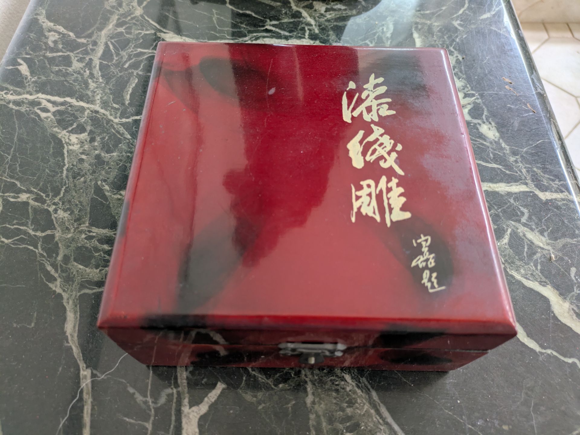 Unique red wooden box. Has cool gold Asian characters on the top