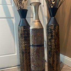 3 metal vases with foliage