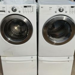 LG FRONT LOAD WASHER AND GAS DRYER WITH PEDESTALS “ BOTH WORKING “