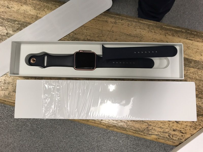 Apple Watch series 1 42 mm rose gold aluminum case and midnight blue sport band..