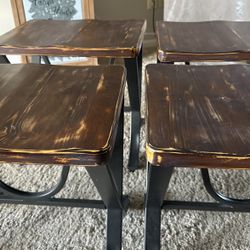 Four Heavy Wood Distressed Table Stools.