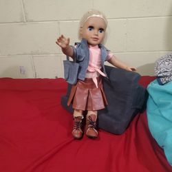 Doll/girl with clothes, boots and handbag