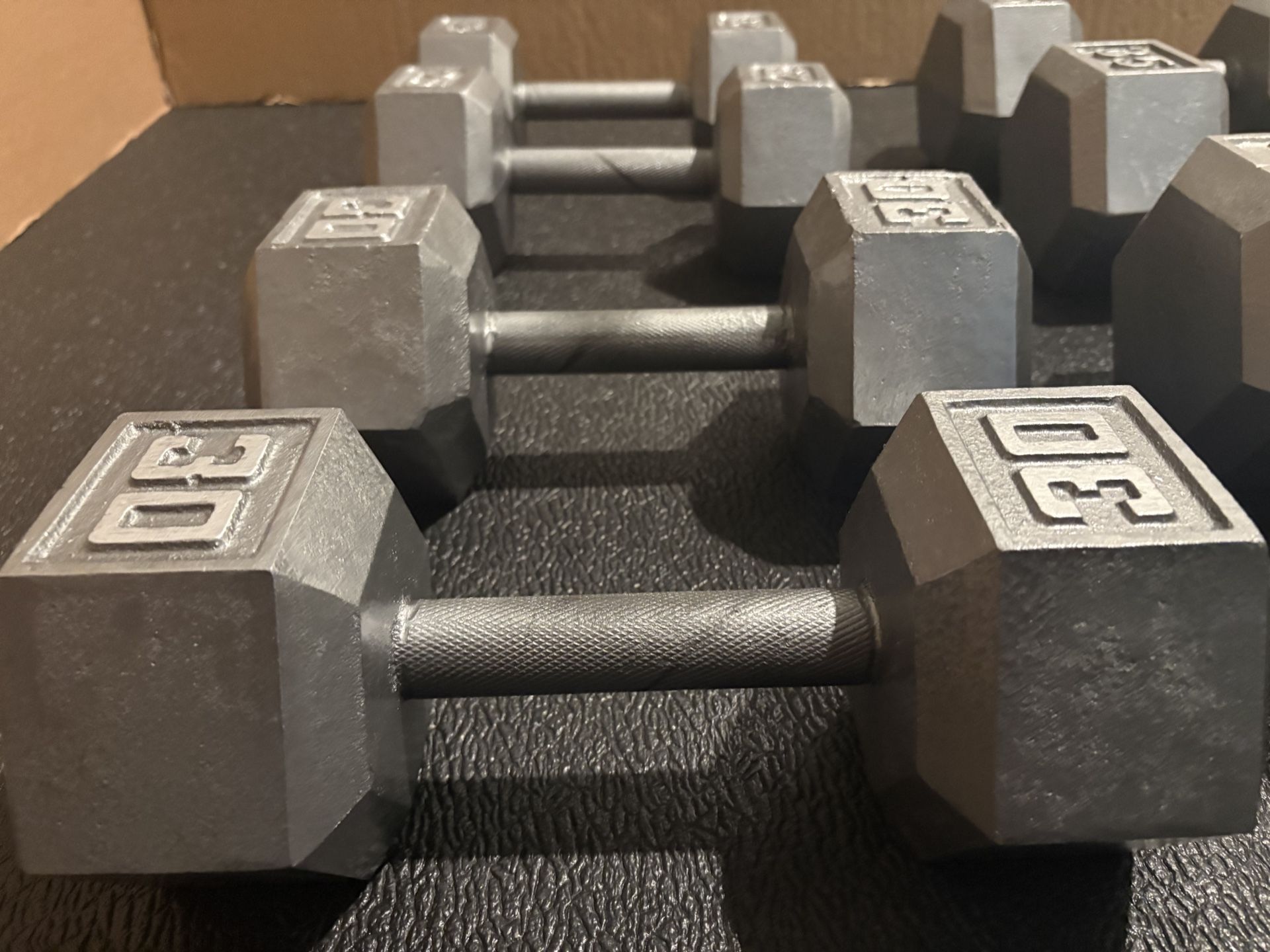 Set of Hex Cast Iron Dumbbells heavy) 40#, 35#, 30# and 25 In