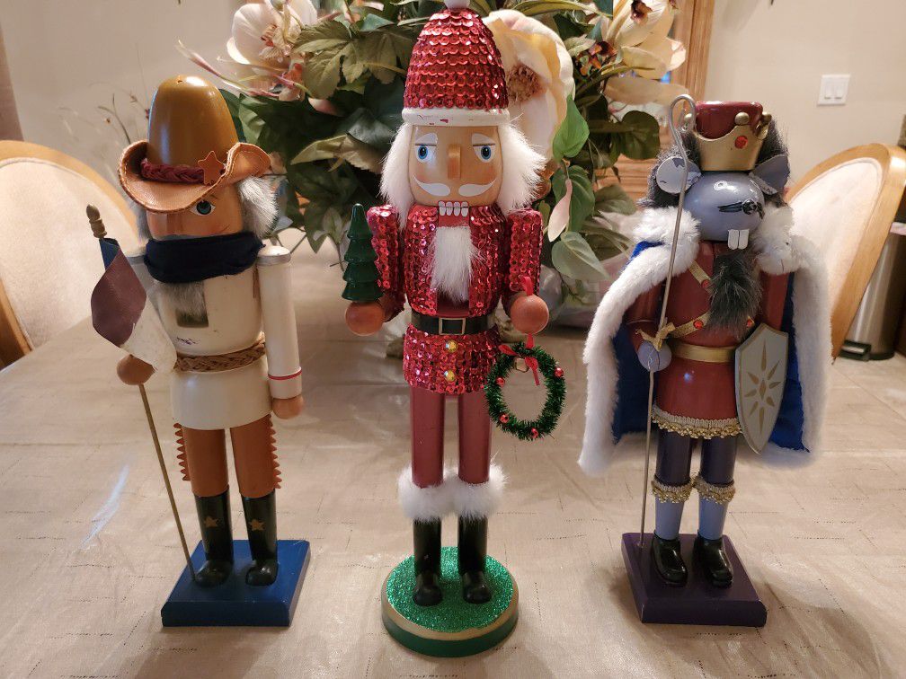 3- Large Nutcracker Soldiers, 1 - Mouse, 1 - Santa, 1- Cowboy. approx. 16 inches high. Quality wood Holiday Decorations