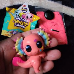 Axolotl Toy And Pink Sand