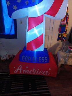 Inflatable 8 foot God bless America lighted cross.