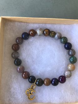 Mix gemstone stretch bracelet with om charm. Size 7.5 inches