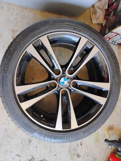 One bmw 255/40/18 tire with rim