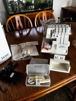 White Speedylock 1600 Serger sewing machine In box. Complete with all accessories and manual.