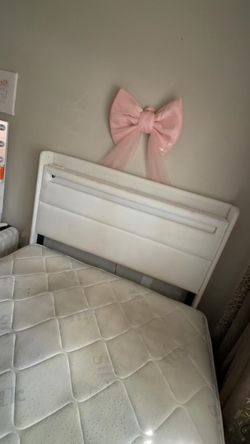 White bed frame without mattress