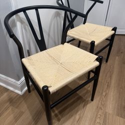 2 black wishbone weaves chairs