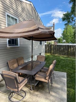 Patio table, chairs and umbrella with stand