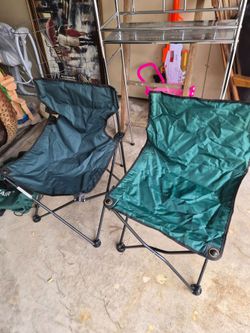 Two green folding chairs
