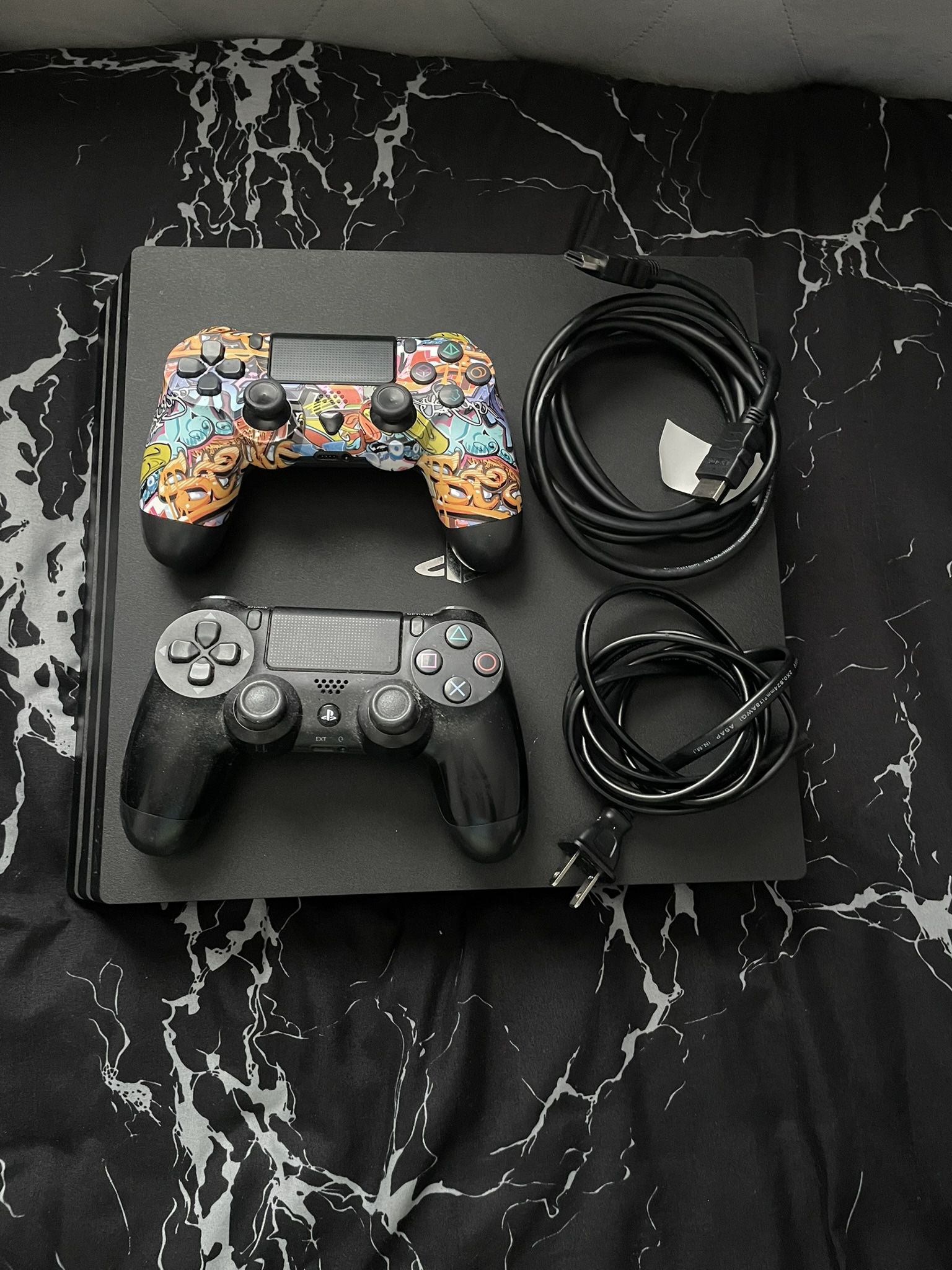 PS4 pro with two dual shock controllers