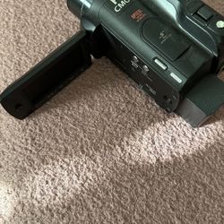 Canon HD Vixia Camcorder with SD hard drive with two lenses,, and the battery and charger.