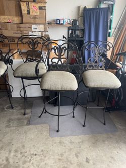 Set of 4 Wrought Iron Bar Stools one stool the iron center is broken out. Still solid
