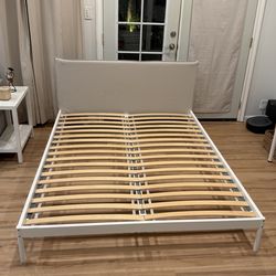 Queen platform bed frame with upholstered headboard
