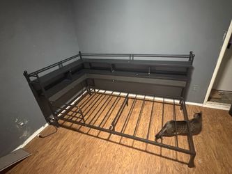 Twin sized bed with outlets and led connector.