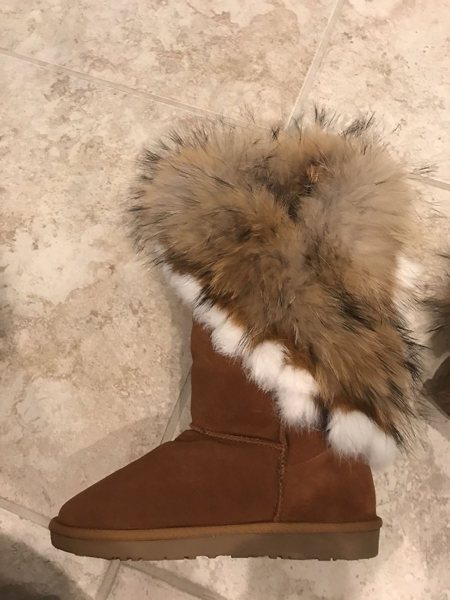 Real sheep skin plus real Fox fur on the outside size 8-9 female