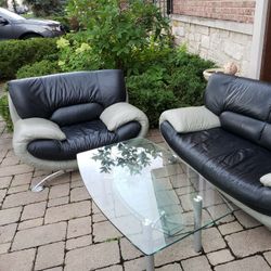 Leather chair and 2 person sofa with glass coffee table