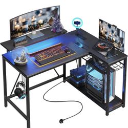 Q117-Gaming Desk with Power Outlets, 42" L-Shaped Computer Desk with LED Lights, Desk with Reversible Storage Shelves & Hooks for Small Spaces, Bedroo