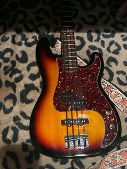 squier pj bass sunburst with tortoise pickguard