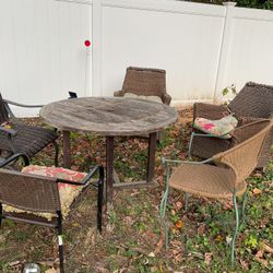 A Set Of Patio Furniture With Wooden Table , Different Type Of Chairs ( Just Need Cleaning For Being Outside)