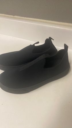 Woman’s black slip Ons