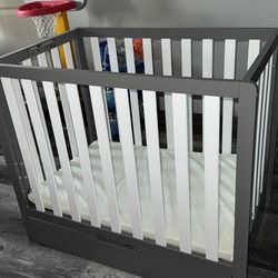 Graco mini crib- slate grey- with storage