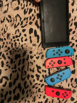 Nintendo Switch Console with 4 Joy-Con Controllers