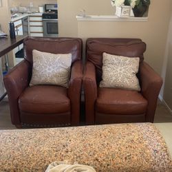 Matching cowhide accent chairs